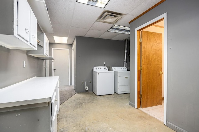 laundry area with cabinets and independent washer and dryer