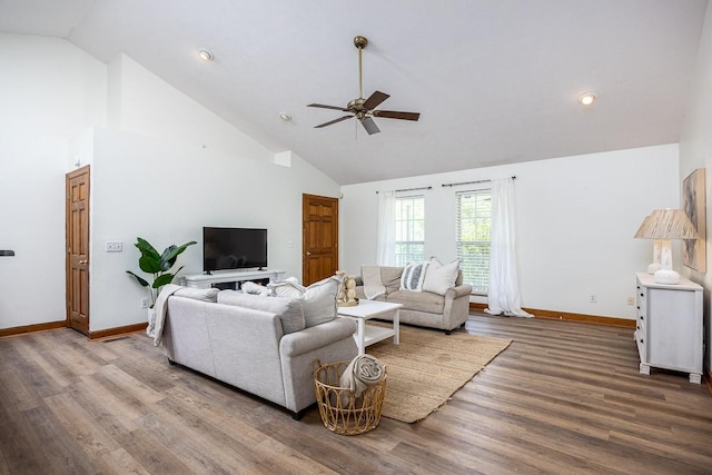 living room with hardwood / wood-style flooring, high vaulted ceiling, and ceiling fan