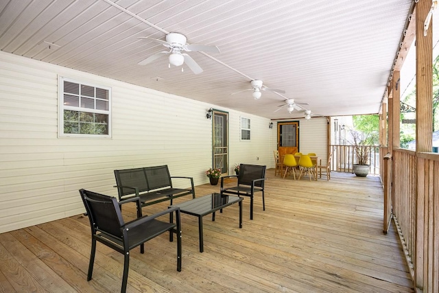 wooden deck with ceiling fan and an outdoor hangout area