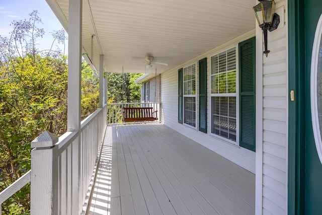 wooden terrace featuring ceiling fan