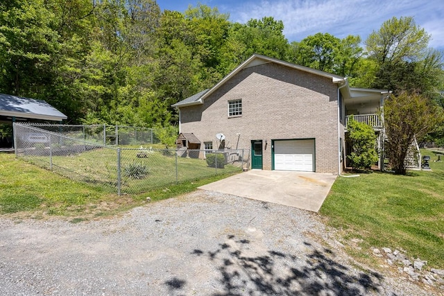 view of property exterior featuring a garage and a yard