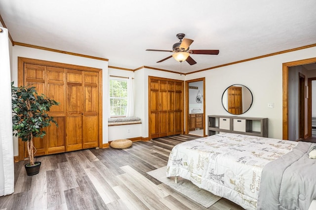 bedroom featuring hardwood / wood-style flooring, ceiling fan, and crown molding