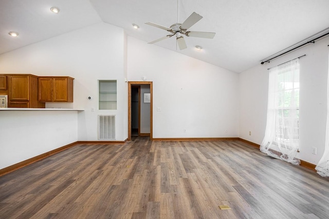 unfurnished living room featuring ceiling fan, high vaulted ceiling, and hardwood / wood-style floors