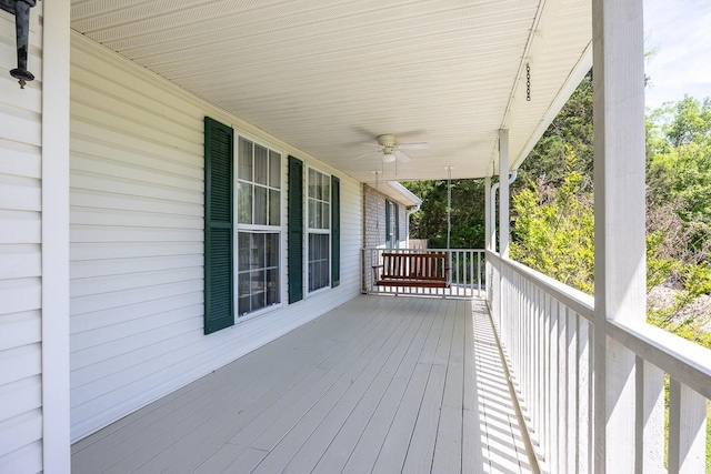 wooden terrace featuring ceiling fan