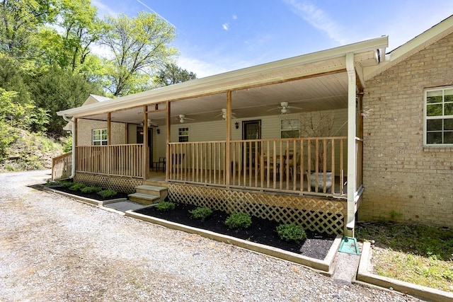 view of front of property featuring ceiling fan and covered porch