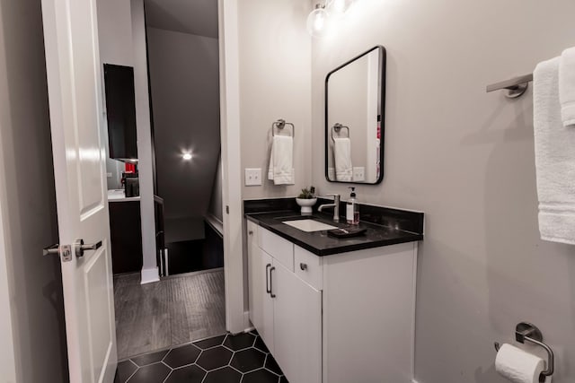 bathroom featuring vanity and hardwood / wood-style flooring