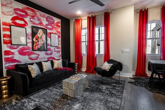 living room with hardwood / wood-style flooring and ceiling fan