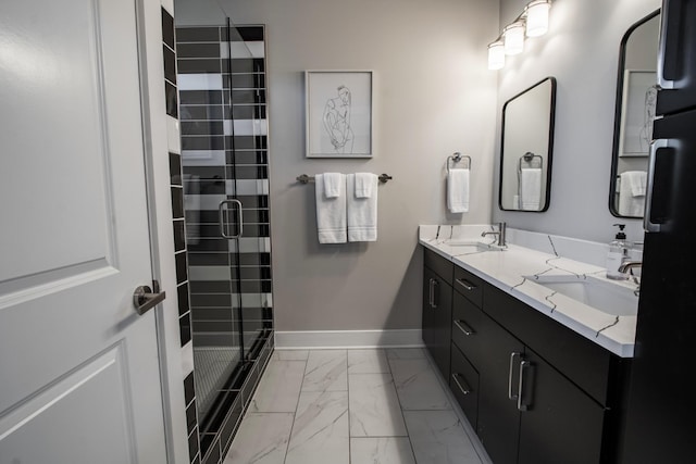 bathroom featuring vanity and a shower with shower door