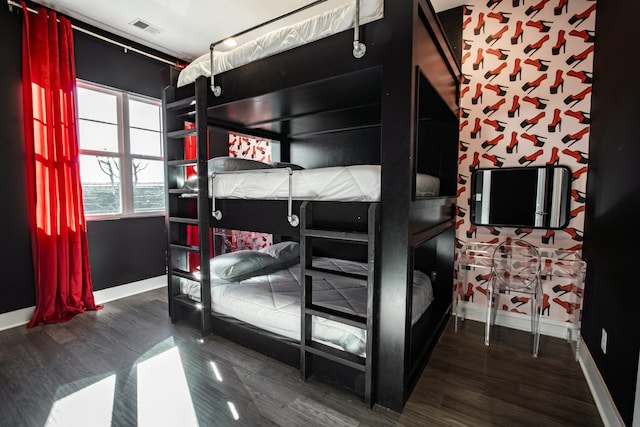 bedroom featuring dark hardwood / wood-style flooring