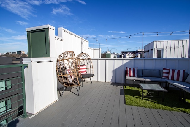 wooden terrace featuring an outdoor living space