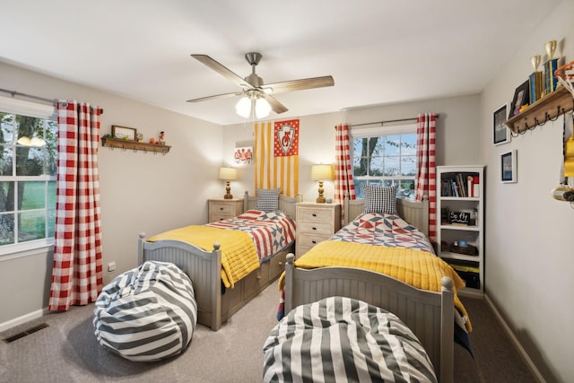 bedroom with ceiling fan and carpet