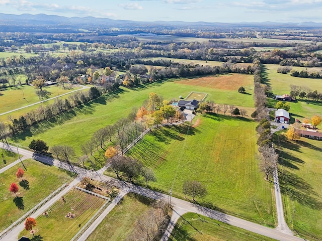 drone / aerial view with a mountain view and a rural view