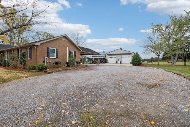 view of front facade with a carport and a garage