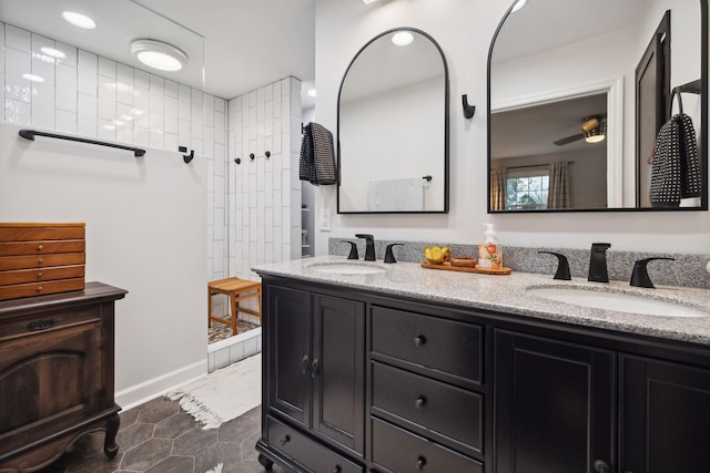 bathroom featuring vanity and tiled shower