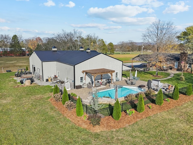 view of swimming pool with a yard and a pergola