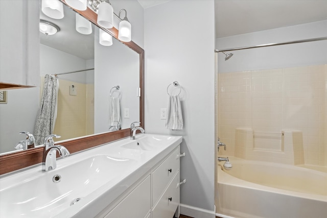 bathroom featuring vanity and shower / bath combo with shower curtain