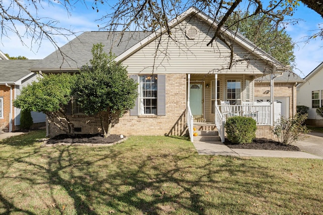 bungalow-style home featuring a garage, a front yard, and covered porch