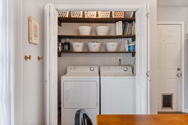 washroom featuring washing machine and clothes dryer