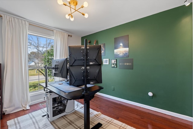 home office featuring a notable chandelier and wood-type flooring