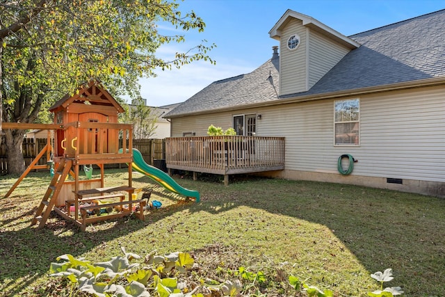 view of playground with a yard and a deck