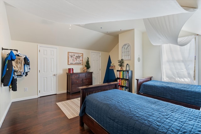 bedroom featuring dark hardwood / wood-style floors and vaulted ceiling