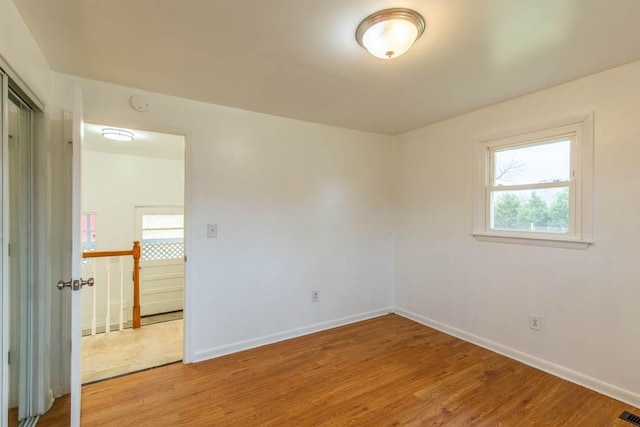 spare room featuring hardwood / wood-style floors