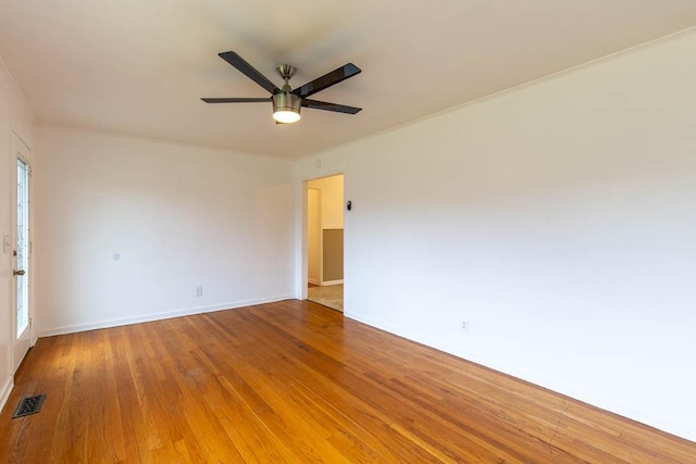 spare room featuring hardwood / wood-style flooring and ceiling fan