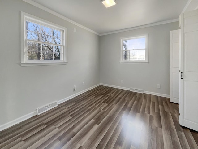 unfurnished bedroom featuring crown molding and dark hardwood / wood-style floors