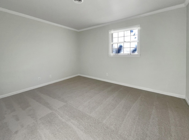 carpeted spare room featuring crown molding