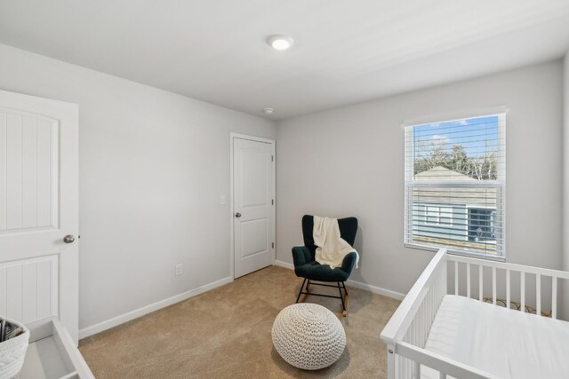 bedroom featuring light carpet