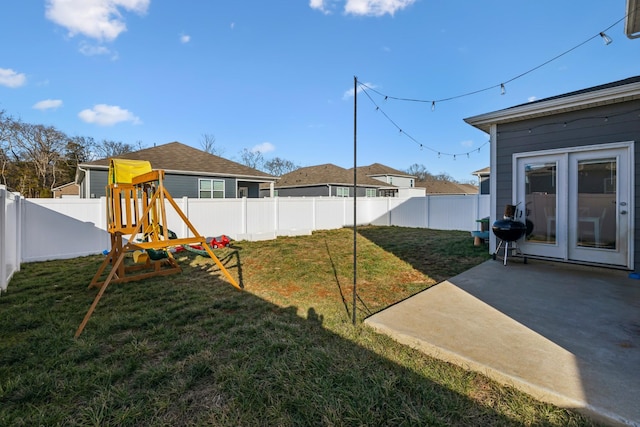 view of yard with a playground and a patio