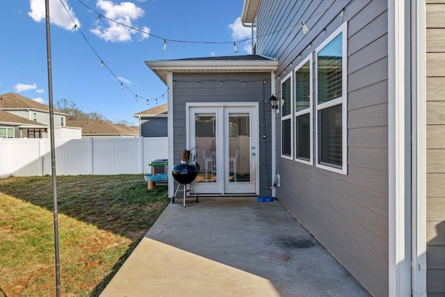 property entrance featuring a yard and a patio