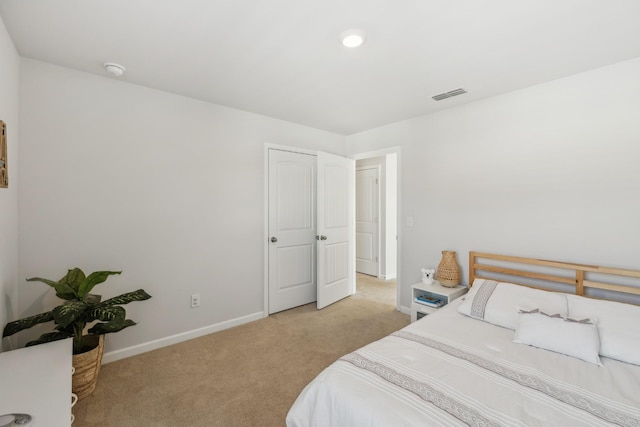 bedroom with light colored carpet