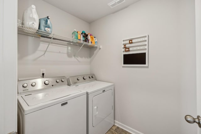 washroom with washer and clothes dryer