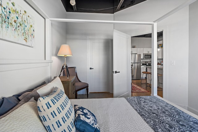 bedroom with stainless steel fridge