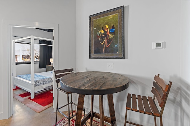 dining room featuring concrete flooring