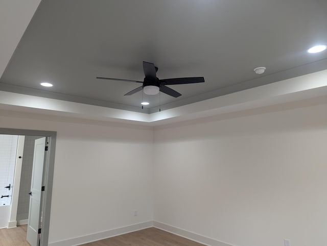 unfurnished room with ceiling fan and light hardwood / wood-style floors