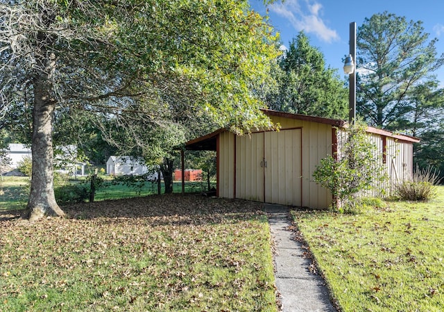 view of outbuilding featuring a yard