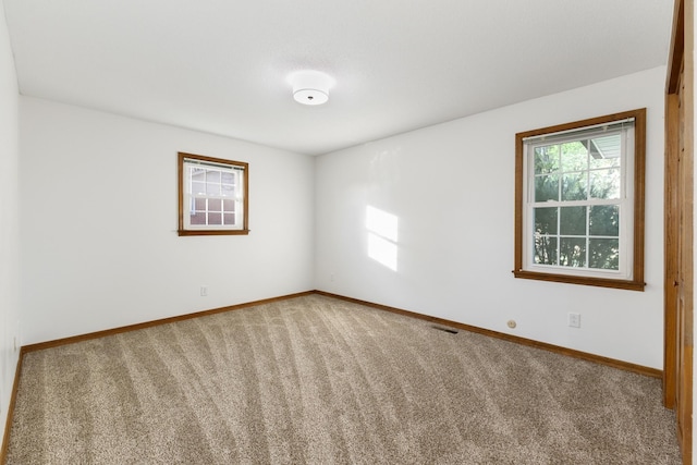 empty room with carpet flooring