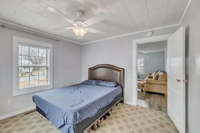 bedroom featuring crown molding and ceiling fan