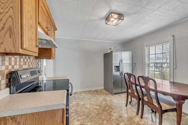 kitchen featuring stainless steel appliances and crown molding