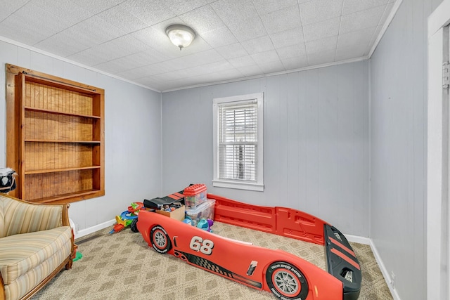 bedroom with crown molding and carpet