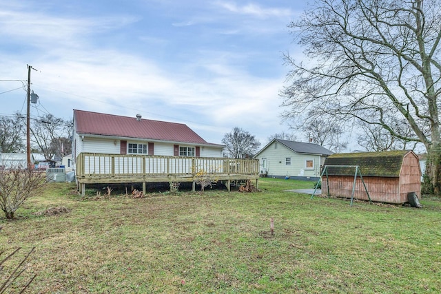 view of yard with a storage shed and a deck