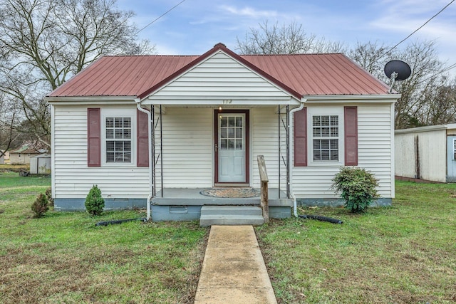 bungalow featuring a front lawn and covered porch