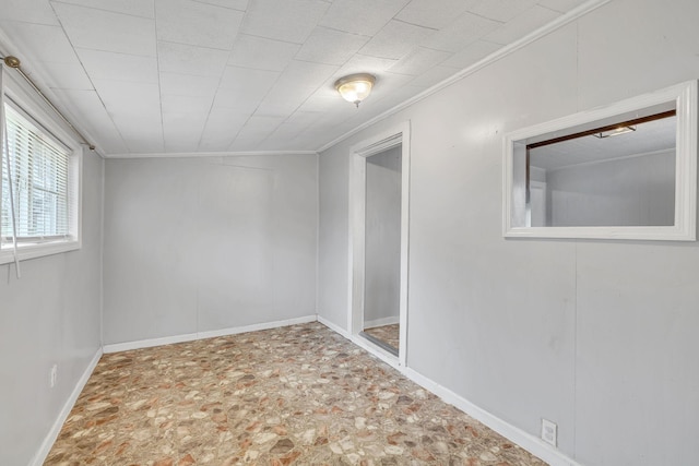 unfurnished room featuring ornamental molding