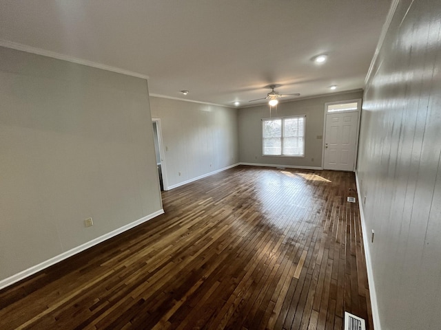 spare room with crown molding, dark hardwood / wood-style floors, and ceiling fan