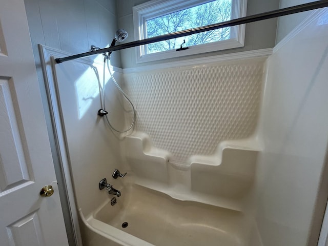 bathroom with bathing tub / shower combination