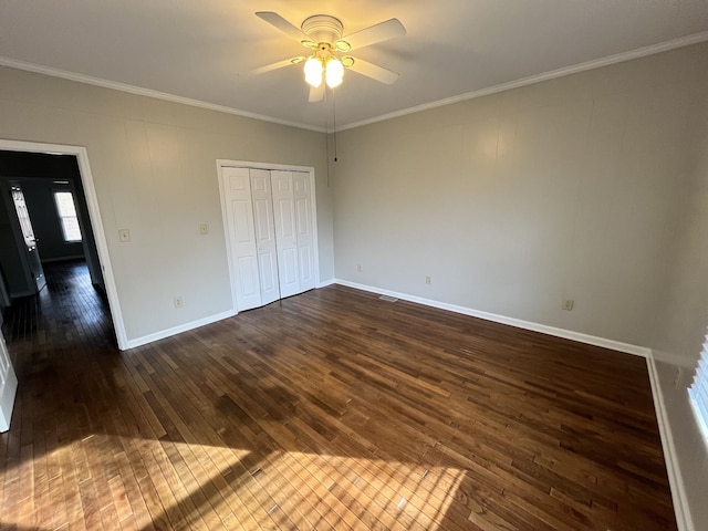 unfurnished bedroom featuring crown molding, ceiling fan, and dark hardwood / wood-style floors