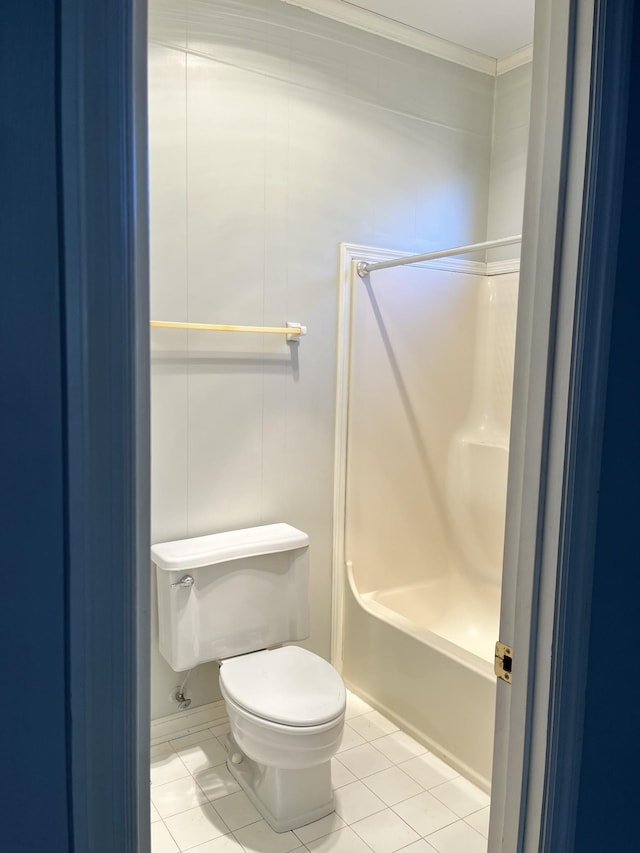 bathroom with toilet and tile patterned flooring