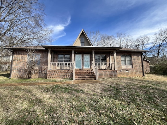 view of front facade with a front yard and covered porch